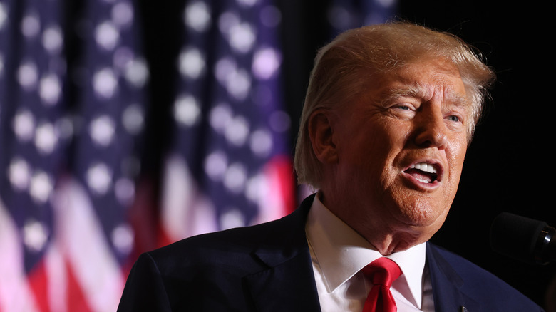 Donald Trump in front of an American flag