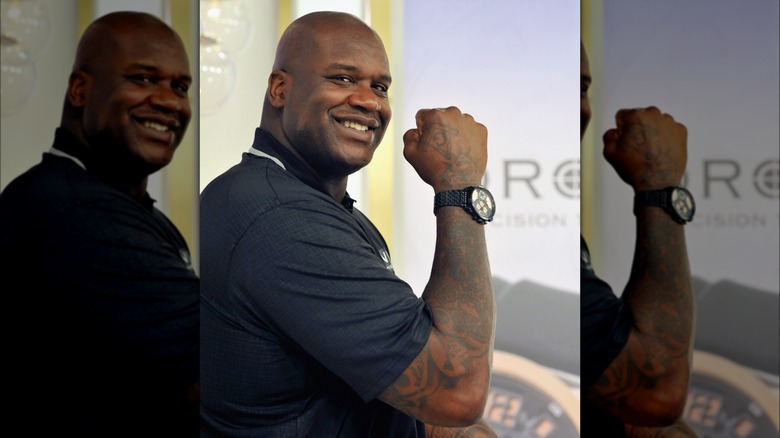 Shaquille O'Neal shows off a watch on HSN