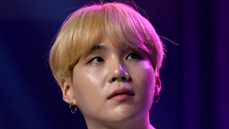 Suga onstage at iHeartRadio LIVE