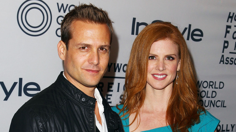 Gabriel Macht and Sarah Rafferty posing