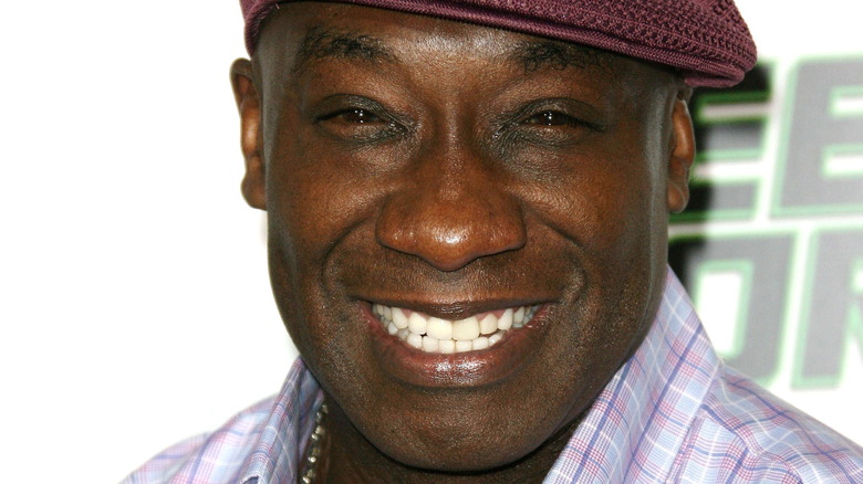 Michael Clarke Duncan smiling in plaid shirt