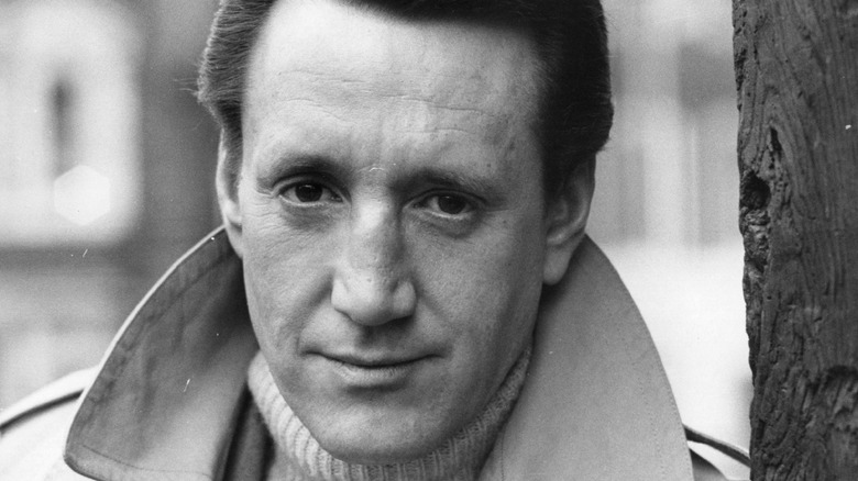 Roy Scheider in turtleneck and coat