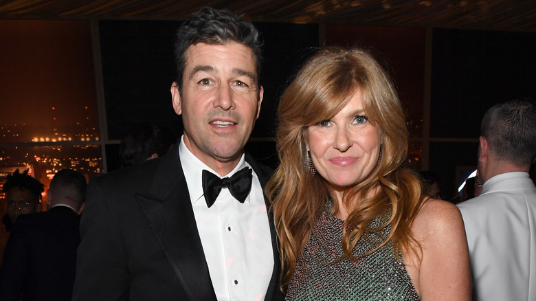 Kyle Chandler and Connie Britton posing in formalwear