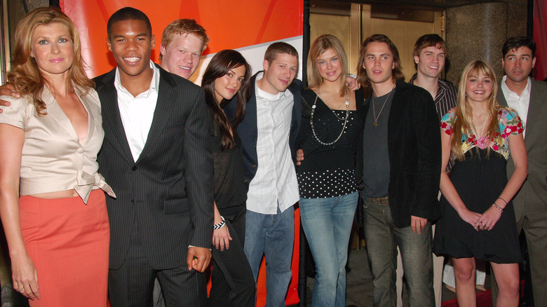 Friday Night Lights cast posing on a red carpet