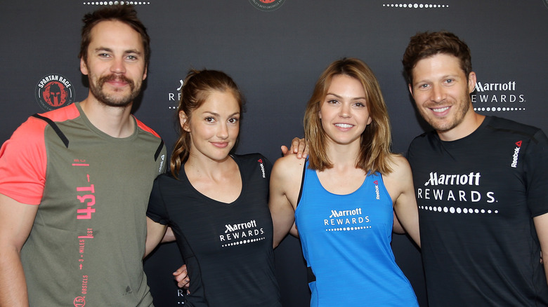 Taylor Kitsch, Minka Kelly, Aimee Teegarden, and Zach Gilford smiling