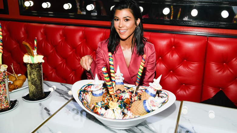 Kourtney Kardashian posing with sweet treats