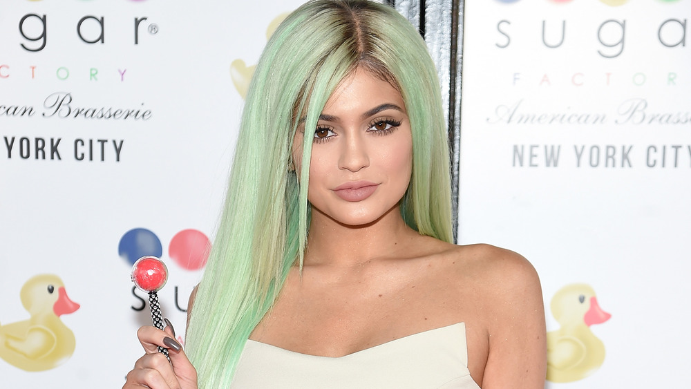 Kylie Jenner poses with a lollipop
