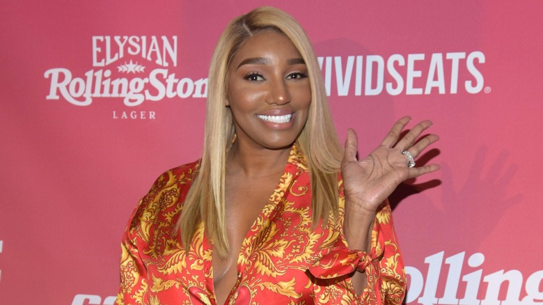 NeNe Leakes waving and smiling