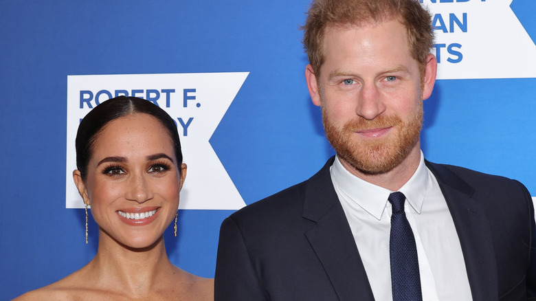 Prince Harry and Meghan Markle posing