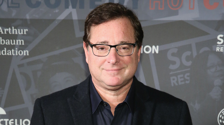 Bob Saget smiling for cameras 