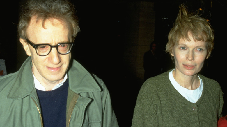Younger Woody Allen and Mia Farrow walking