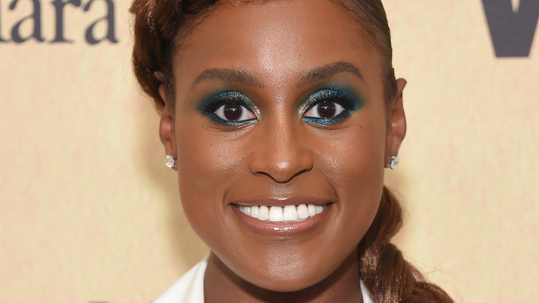 Issa Rae smiles on the red carpet