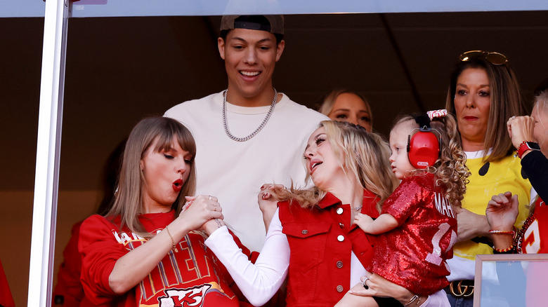 Taylor Swift and Jackson Mahomes watching football