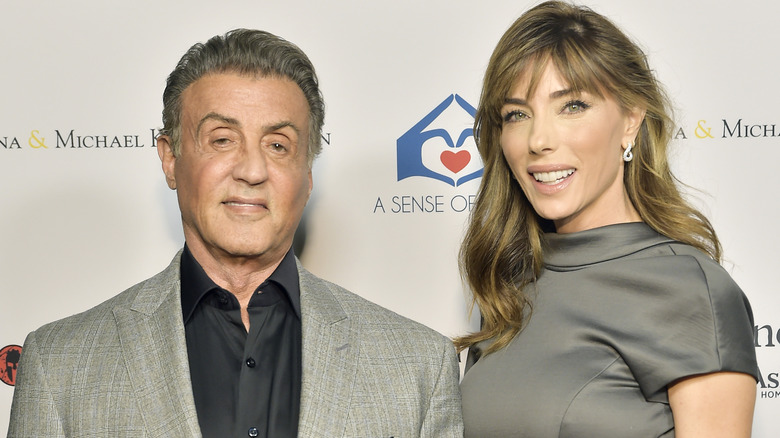 Sylvester Stallone and Jennifer Flavin posing