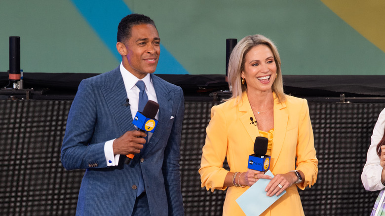 T.J. Holmes and Amy Robach introducing a guest