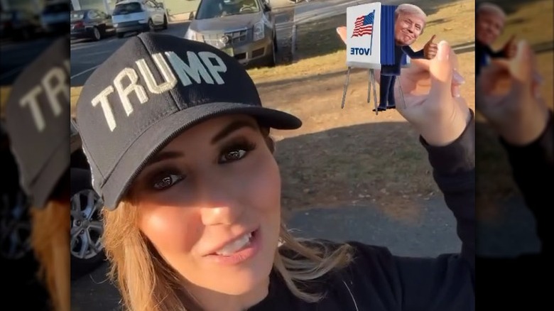 Alina Habba in a black "TRUMP" hat encouraging early voting (2024)