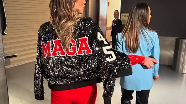 Alina Habba walking backstage of Madison Square Garden wearing a sparkly "MAGA" jacket (2024)