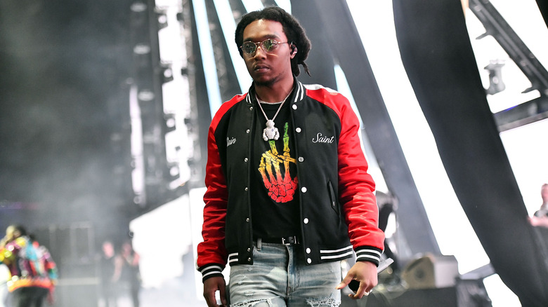 Takeoff wearing a varsity jacket