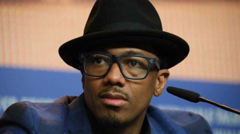 Nick Cannon with hat and glasses