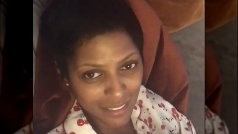 Tamron Hall lying on her couch with no makeup