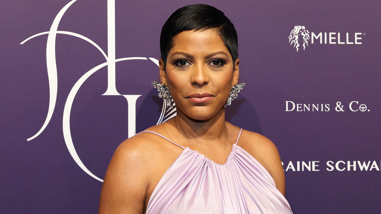 Tamron Hall wearing a pink dress and large jeweled earrings