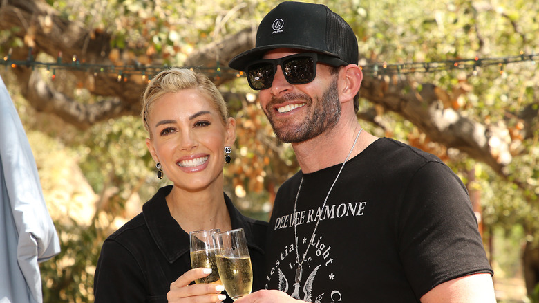 Heather Rae Young and Tarek El Moussa posing