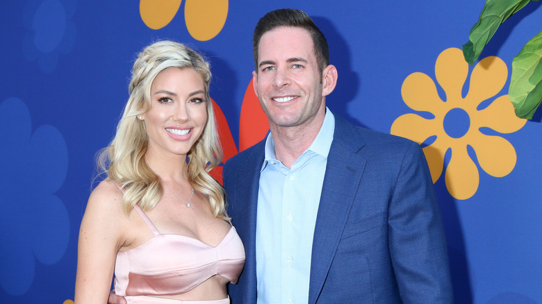 Heather Rae Young and Tarek El Moussa pose in 2019