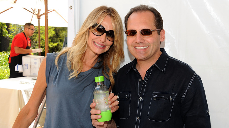 Taylor Armstrong and Russell Armstrong wearing shades