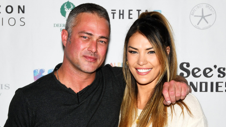 Taylor Kinney and Ashley Cruger smiling