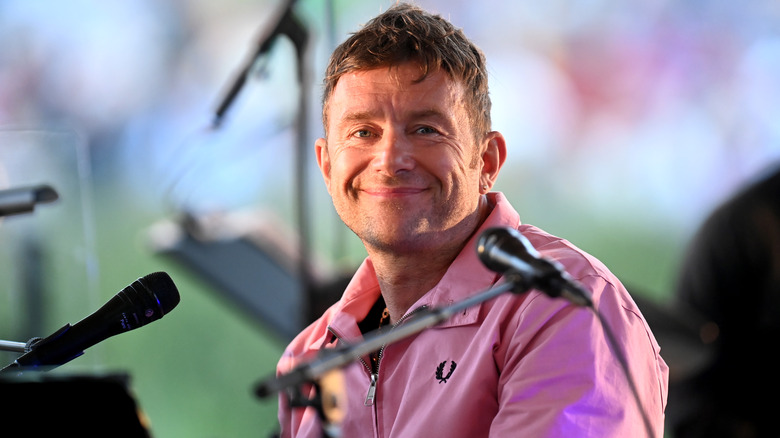 Damon Albarn smiling concert event