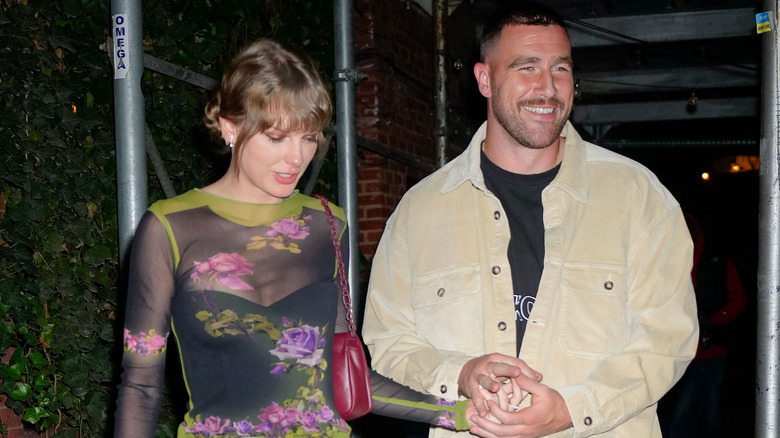 Taylor Swift and Travis Kelce holding hands