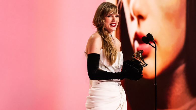 Taylor Swift holding a Grammy