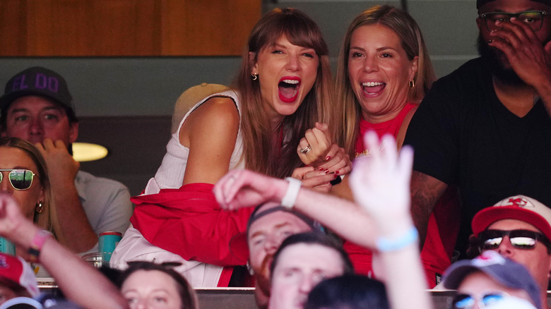 Taylor Swift cheering in white