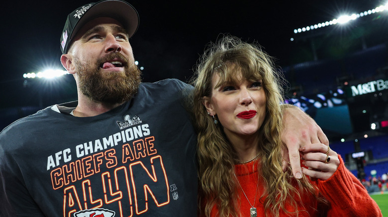 Travis Kelce and Taylor Swift on the field