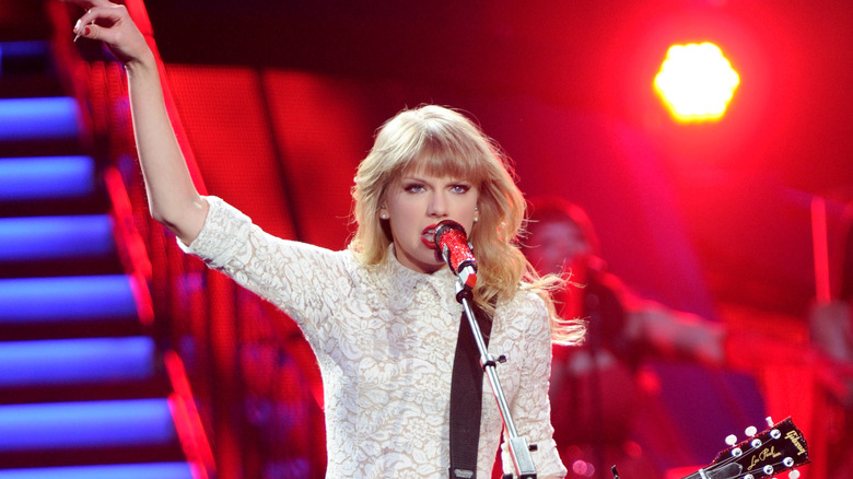 Taylor Swift performing on The RED Tour