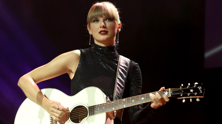 Taylor Swift playing guitar