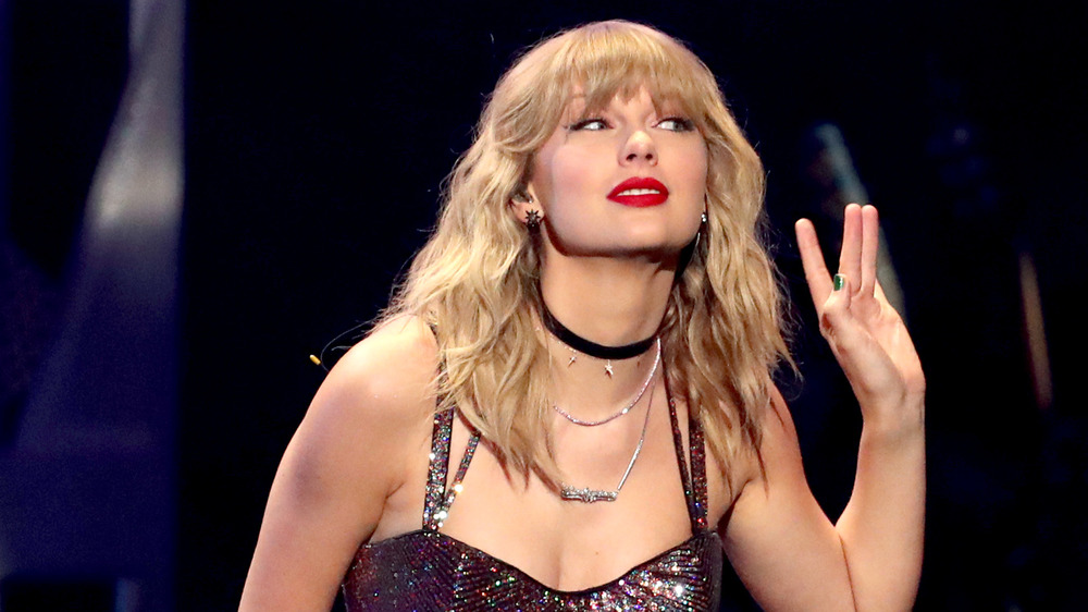 Taylor Swift performing at iHeartRadio's Jingle Ball in 2019