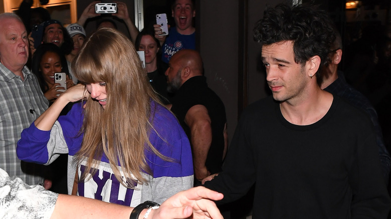 Taylor Swift and Matty Healy walking