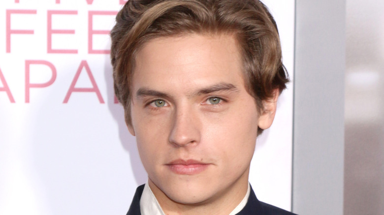 Dylan Sprouse looking at camera