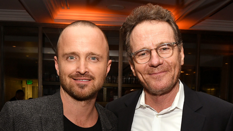 Aaron Paul and Bryan Cranston smiling 