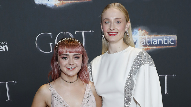 Maisie Williams and Sophie Turner smiling