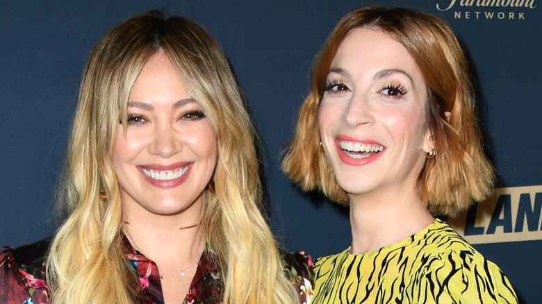 Hilary Duff and Molly Bernard smiling at premiere