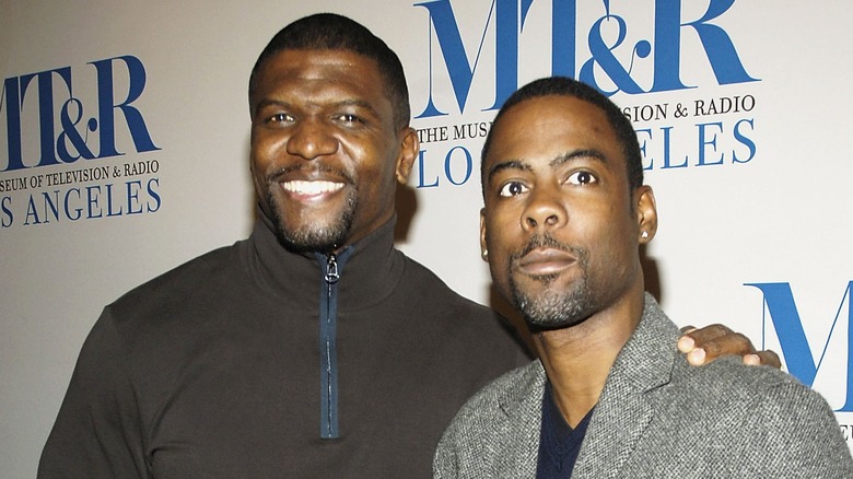 Terry Crews smiling with Chris Rock