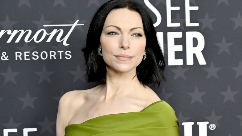 Laura Prepon posing in green dress