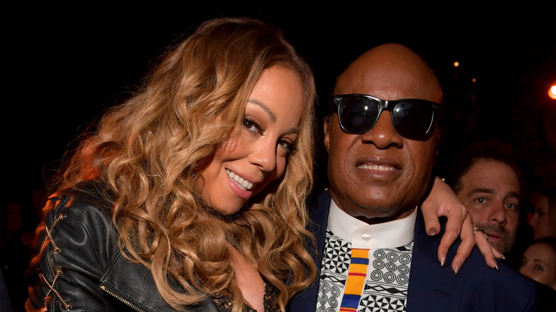 Mariah Carey posing with Stevie Wonder