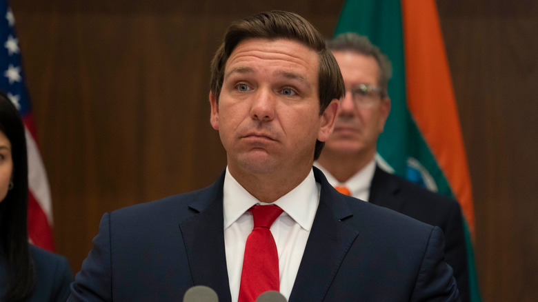 Ron DeSantis behind microphone 