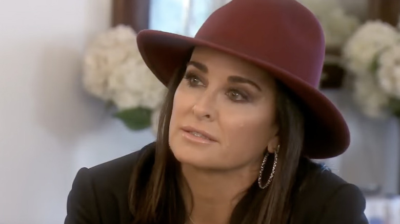 Kyle Richards in a red hat