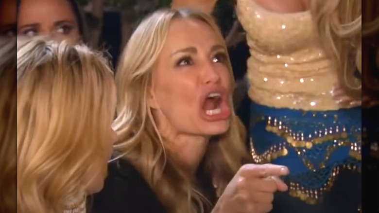 Taylor Armstrong screaming, surrounded by women