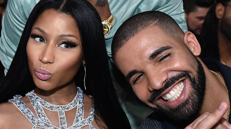 Nicki Minaj posing friendly with Drake