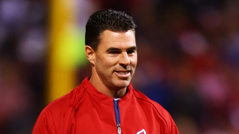 Jim Edmonds standing on a football field